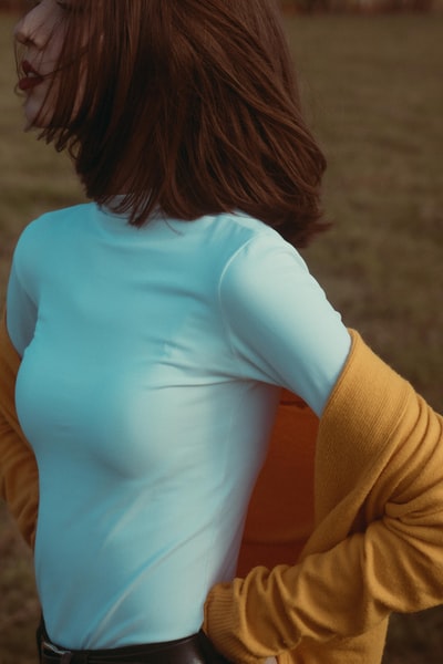 A woman in a white long sleeve shirt
